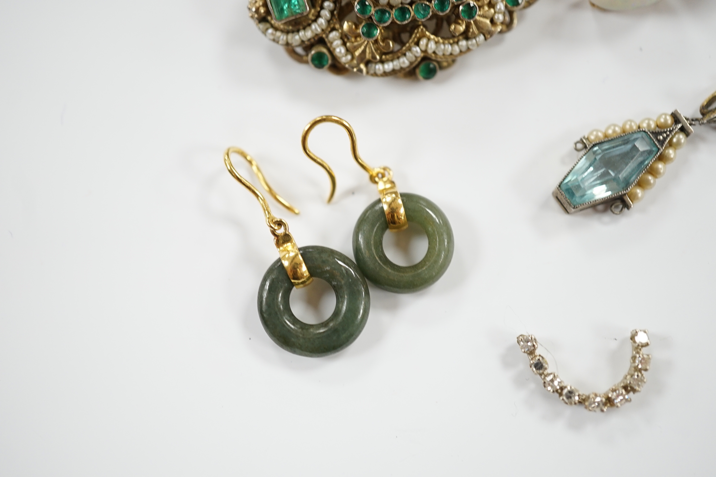 Sundry jewellery including a 19th century Austro-Hungarian gilt white metal, emerald and seed pearl cluster set brooch, 38mm, two pairs of earrings including white opal, a pendant necklace and part of a ring.